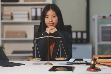Judge gavel with Justice lawyers having team meeting at law firm background. Concepts of Law and...