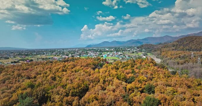 Aerial view of Dry Chandrabhaga River next to the Rishikesh Dehradun national highway, Uttarakhand. Epic Hill Chain Scenery Covered by Lush Green Jungle. The highway goes through Rajaji National Park.