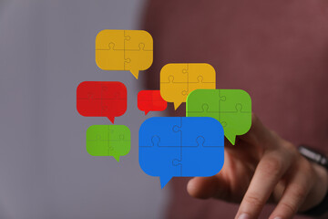Colorful puzzle pieces in speech bubbles represent teamwork, communication, and problem-solving.