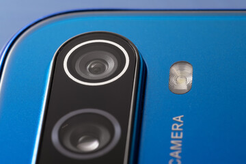 Detailed close-up of mobile phone AI-powered camera array and LED flash in modern sleek design
