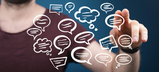 Person interacting with holographic speech bubbles, communication concept.