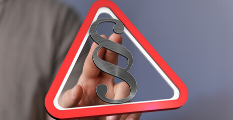 Stock photo of a hand holding a warning sign with a paragraph symbol.  Perfect for legal, law, and...