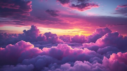 Beautiful cotton candy cloudy sky sunset, with fluffy clouds and varied textures featuring deep dark and light shades of purple, pink, yellow, orange, and blue in the background.