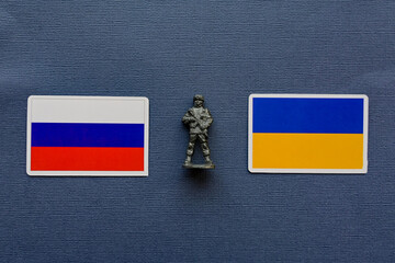 Flags of Russia and Ukraine on a blue background. The Russian-Ukrainian conflict.