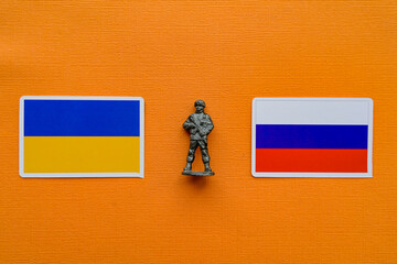 Flags of Russia and Ukraine on a yellow background. The Russian-Ukrainian conflict.
