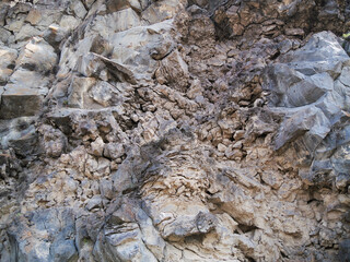 Stone texture with fractures and exposed earth. Can be used as elements or background for design projects.