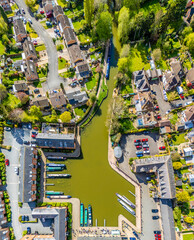 An aerial view directly above the canal and the canal basin in the town of Market Harborough, UK on a bright day in springtime