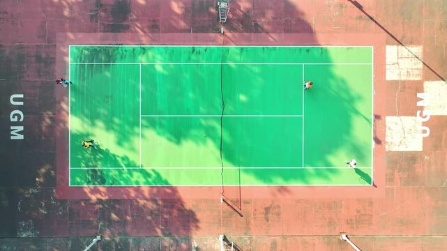 Aerial View of Badminton Game on a Green Court, UGM Sport Complex