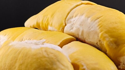Fresh durian peel on the table with black background.