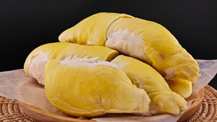 Fresh durian peel on the table with black background.