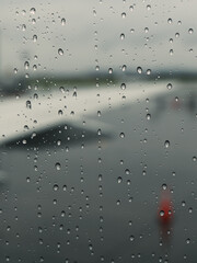raindrops on plane window