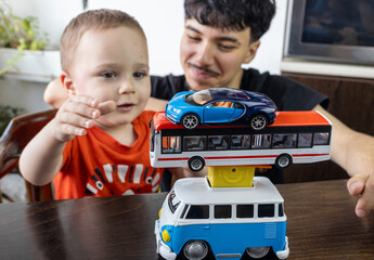  Two Jewish Half-brothers - 2,5 and 17 year old are playing with model cars.