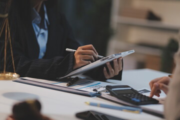 Consultation and conference of lawyers and professional businessman working and discussion having at law firm in office. Concepts of law, Judge gavel with scales of justice.