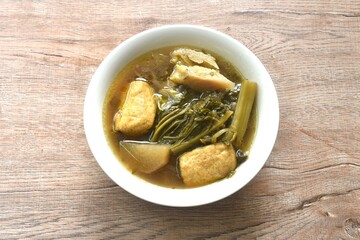 boiled braised mixed vegetable with tofu in Chinese herb stew soup on bowl 