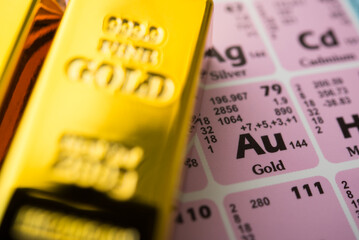 Au (Gold) in the periodic table with gold bar. Gold is popular in commodity trading market investment, price rising all time high, chemistry education concept.  It is safe haven and forex reserves.