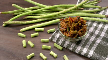 Fresh organic or French beans green peas on wooden background.Healthy food concept.