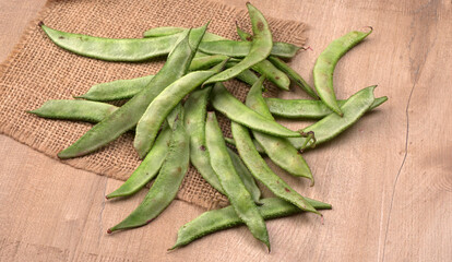Pile of green beans over wooden background, Healthy food concept 
