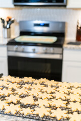 Cooling Snowflake-Shaped Sugar Cookies on a Rack