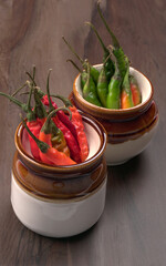 Fresh long Indian green and red chillies on beautiful background. Organic Indian spices for hot and spicy cuisine. 