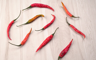 Fresh long Indian green and red chillies on beautiful background. Organic Indian spices for hot and...