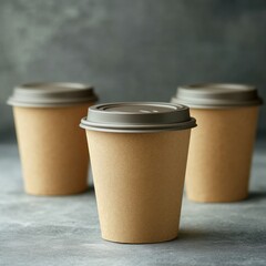 Paper cups with lids on a gray background. Blank for a mockup
