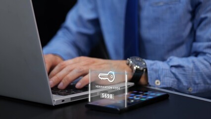 Man typing his password and verification to a two steps authentication on laptop 