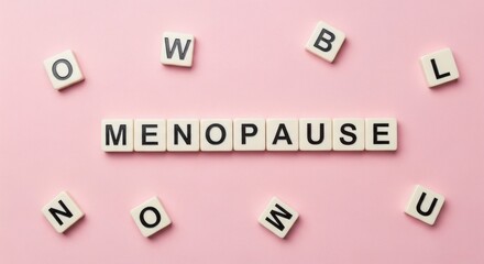 Menopause Word Tiles Female Health Concept on Pink.