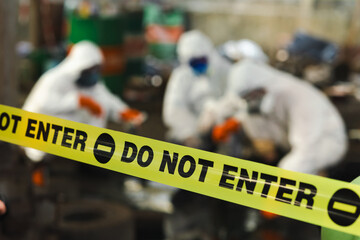 do not enter barrier cross tape : No trespassing. Officials from the Department of Hazardous...