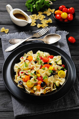 salad of farfalle pasta with veggies and olives