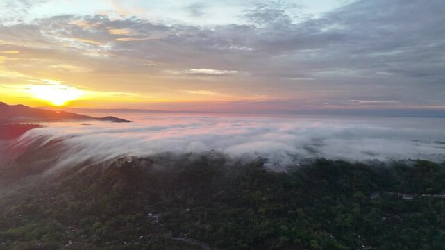 Sunrise Above the Misty Hills of Central Java, Indonesia