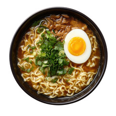 A top down view of a bowl of ramen with egg green onions and meat on a black background close up