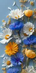 Vibrant floral arrangement featuring daisies, cornflowers, and tulips.