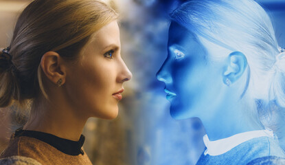 Young woman looks at her reflection in mystical mirror.