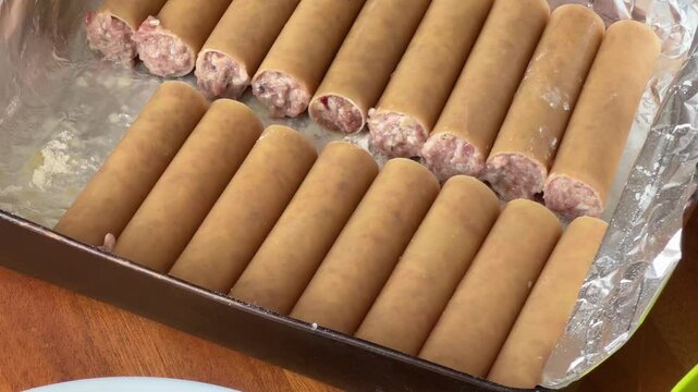 Raw stuffed with meat filling cannelloni pasta, close-up