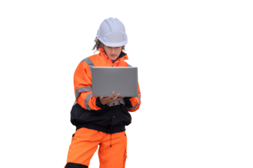Female Engineer in Safety Gear Working on Laptop, Construction Worker Reviewing Plans on Portable Computer, Focused Woman in Hi-Vis Jacket Using a Laptop