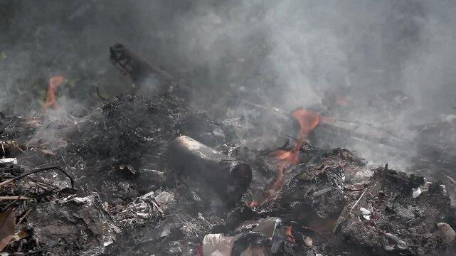 Open burning of waste near the yard area