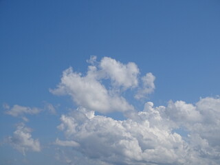 The shape of the clouds in the blue sky is very enchanting