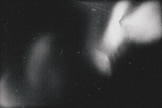 retro film overlay effect with scratch dust and light leaks,retro grain noisy film distressed texture light leak flare on black background,Black and white background