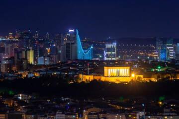 Naklejka premium Night view of Anıtkabir, the mausoleum of Mustafa Kemal Atatürk in Ankara, illuminated beautifully with the city skyline. A symbol of Turkish history and national pride.