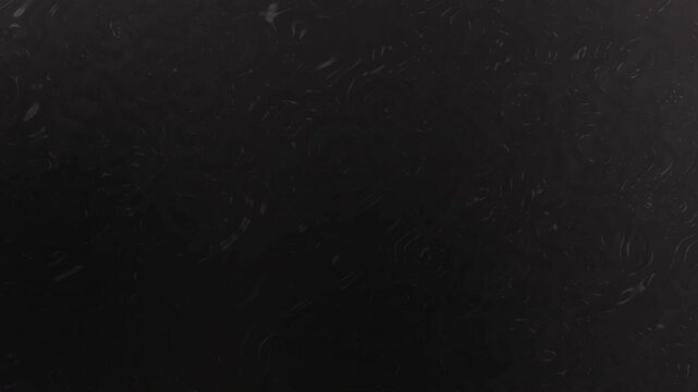Dark background with subtle texture patterns.