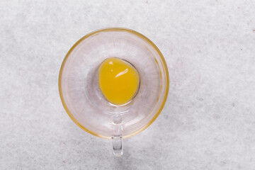 Overhead view of jelly dessert in a glass cup, top view of gelatin pudding in a glass mold, process of making jelly dessert