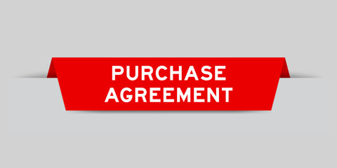 Red color inserted label with word purchase agreement on gray background