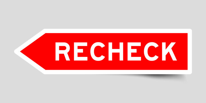 Red color arrow shape sticker label with word recheck on gray background