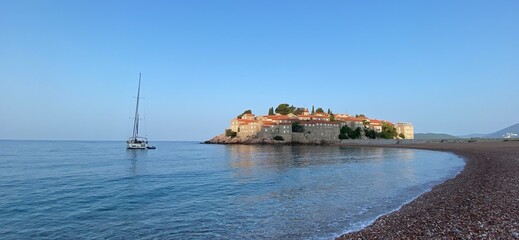 Montenegro Adriatic Sea coast Sveti Stefan, sandy beach and next to luxury resort island, panorama