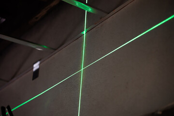 Laser cross alignment project indoor workshop technology process efficient setup close-up view precision measurement