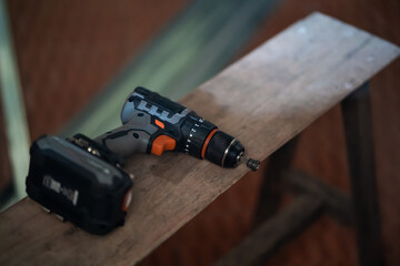 Naklejka premium Power drill in use workshop tool photography interior space close-up view home improvement concept