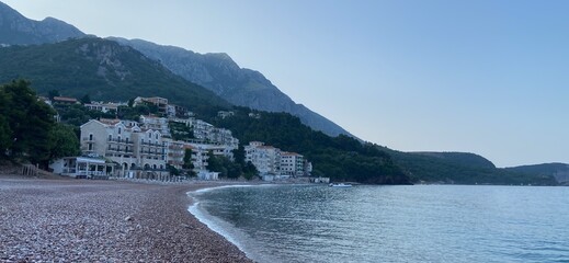 Montenegro Adriatic Sea coast Sveti Stefan, sandy beach and next to luxury resort island, panorama