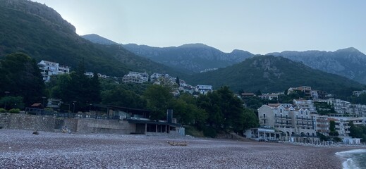 Montenegro Adriatic Sea coast Sveti Stefan, sandy beach and next to luxury resort island, panorama