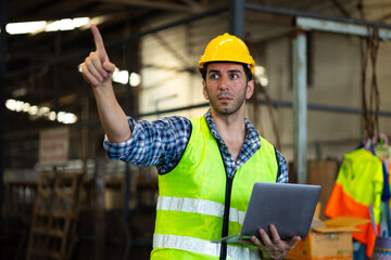 Portrait laptop computer : Hispanic male worker. Professional Mechanical Engineer worker wearing...
