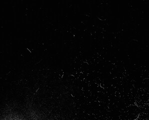 Abstract dirty dust particle grain texture for overlay effect with space for vintage grunge design. White dust on a black background. Noise black background overlay, abstract film noise, black texture